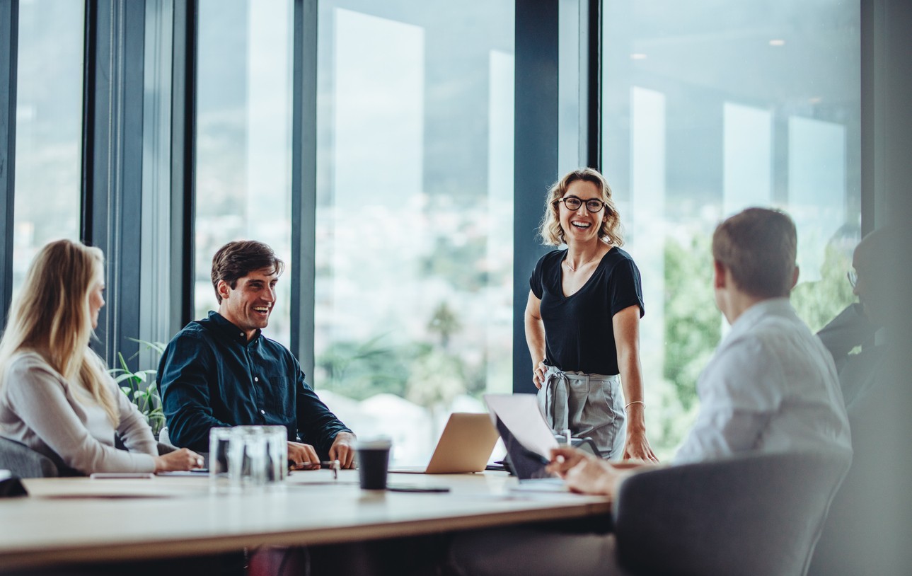 Business professionals collaborating on workplace wellness and mental health insurance benefits